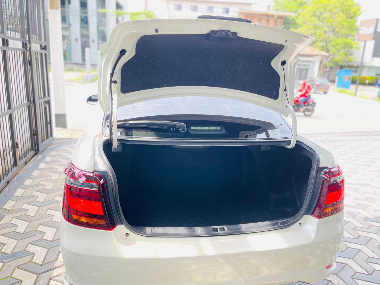 Toyota Axio rear view with open boot + boot space